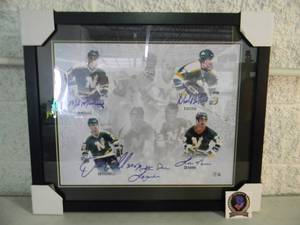 lot 56 image: MINNESOTA NORTH STARS LEGENDS SIGNED By ALL FOUR  #9 Mike Modano, #7 Neil Broten, #20 Dino Ciccarelli & #23 Lou Nanne professionally framed and autographed with COA, Approx 27 by 23 - NEW - A VERY NICELY DONE PIECE - SEE PICTURES