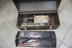 lot 229 image: Metal tool box, leather belt and tools