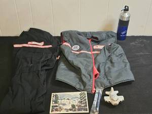 lot 195 image: Airline Memorabilia Lot Northwest Airlines Jacket, Delta Water Bottle, Postcard, Stress Toy, Pen