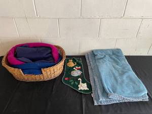 lot 56 image: Wicker Basket with Blankets and Kitty Christmas Stocking