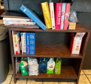 lot 139 image: Wood Bookshelf with Cookbooks and Gardening Supplies