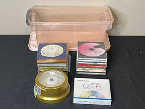 lot 303 image: Lot of Memorex DVDs, CDs, and Plastic Storage Bin