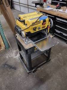 lot 35 image: DeWalt 13in Thickness Planer DW735 and 19-34-in cast base