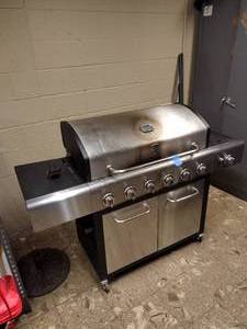 lot 49 image: Kenmore Gas-Propane Grill Model PG-40611504. Includes a LP tank and a black cover