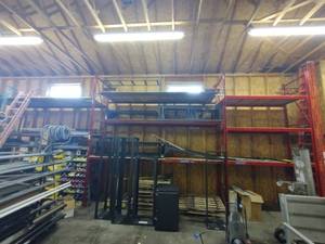 lot 193 image: Steel Palette racking w plywood surfaces. 2 sections measure 14L x 35D x147H One Measures 84L x 35D x 147 H