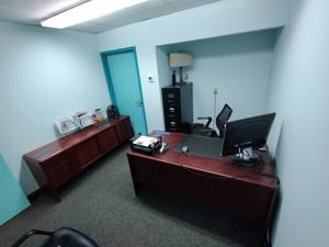 lot 47A image: Wood office desk, credenza, 4-drawer metal file cabinet and adjustable office chair.