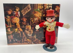 lot 87 image: Vintage CELLUOID Monkey Clown with a Vintage MONKEYING AROUND SPRINGBOK Puzzle