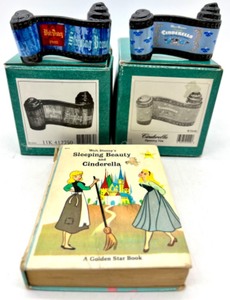lot 251 image: WDCC DISNEY CLASSIC SLEEPING BEAUTY & CINDERELLA Opening Title Scroll Figures with A GOLDEN STAR BOOK Cinderella & Sleeping Beauty