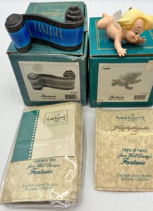 lot 252 image: WDCC DISNEY CLASSIC FANTASIA Opening Title Scroll Figure & FANTASIA FLIGHT OF FANCY CUPID Figure - NIB with COA