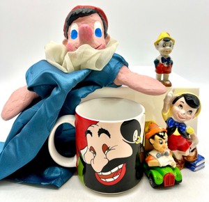 lot 254 image: Fun Lot of Vintage PINOCCHIO Items including a PINOCCHIO Hand Puppet,JAPAN PINOCCHIO Figurines, PINOCCHIO Toy Car and Coffee Mug