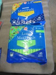 2 pks Maxi Pads...