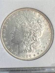 1886 US MORGAN SILVER DOLLAR SLABBED