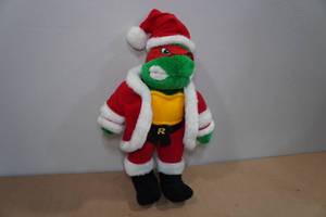 lot 105 image: Vintage Teenage Mutant Ninja Turtle Santa Raphael Plush Doll