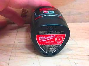 lot 25 image: Lot of 2 - Milwaukee M12 Red Lithium 2Ah Battery Model # 44-11-2420 (Retail $64.97 Each)