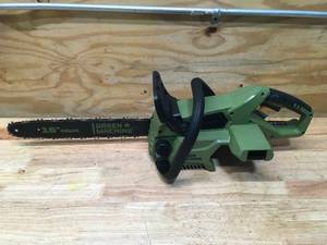 lot 8 image: Green Machine Cordless Chainsaw With 2.5AH Battery And Charger Model # GMCS6200