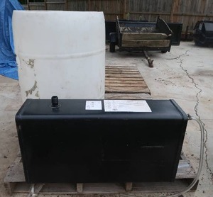 WATER TANK AND WHITE 55 GAL BARREL.
