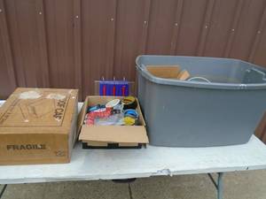 Misc tubs of tape, weatherstripping & roof vent. As shown.