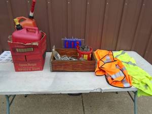 Misc gas cans, hardware & safety vest. As shown.