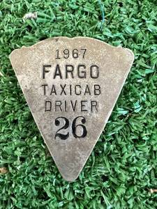 lot 96 image: 1967 Fargo ND Taxicab Driver Pin #26