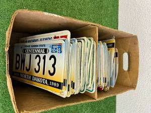 lot 107 image: Box of License Plates