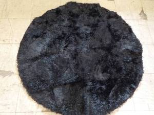 lot 76 image: 47 Diameter Black Flurry Area Rug...