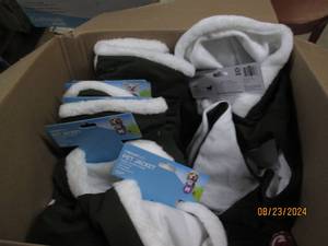 box of pet jackets various sizes...