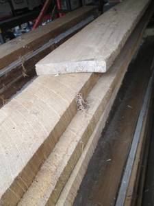 lot 104 image: Lot of Rough Cut Lumber Planks