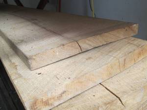 lot 107 image: Stack of Unfinished Wood Planks
