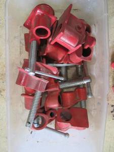 lot 118 image: Lot of Red Scaffold Clamps, Hooks, and Caster Wheels