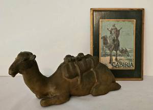 lot 505 image: Unique Movie Replica Poster on Wood Plus Camel Figure