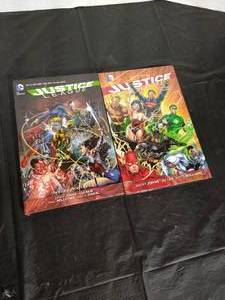 lot 77 image: (2) Justice League Hardcover Graphic Novels