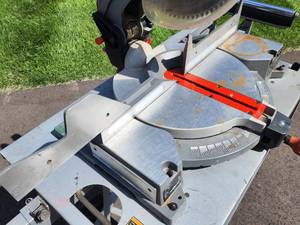 Ridgid 10 Compound Miter Saw on a Portable Rolling Stand