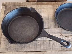 (2) Assorted Round Cast Iron Skillets