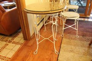 lot A-259 image: Vintage Wrought Iron Patio Set with Glass Top Table and 4 Chairs