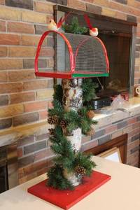 lot 302 image: Rustic Bird Feeder with Pine Cone and Evergreen Decorations