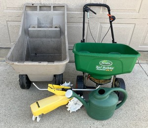 lot 23 image: Nelson Moving Sprinkler, Seed Spreader, Plastic Wheelbarrow and Plastic Watering Jug