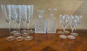 lot 11 image: Eight Crystal Decanters 1980s Essentials Optique Champagne Flutes and 5 Wine Glasses