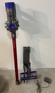 lot 174 image: Dyson V6 Absolute Cordless Vacuum and Charger with Attachments