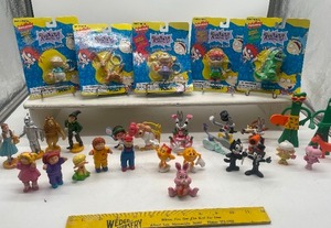 lot 26 image: Vintage 1980s-1990s Figurines and Keychains, Rugrats, Looney Tunes, CPK, Wizard of Oz misc