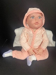 lot 67 image: Wide Eyed Soft Body Realistic Baby Doll 24 Blue Eyes with Lashes Pierced Ears Reborn Doll