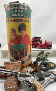 lot 134 image: Vintage Well Loved Toy Guns, Lincoln Logs, John Deere Tractor Red Ryder Fanner