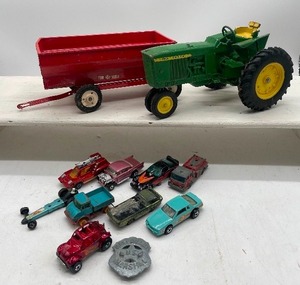 lot 138 image: John Deere Toy Tractor Matchbox Cars, Matt Dillon Badge Vintage Toys