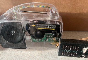 lot 72 image: Free Play Self Powered Clear Acrylic Radio and Vintage Sylvania Personal Radio