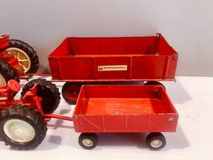 ERTL Red Toy Tractor and Wagon (8��) and Smaller Red Toy Tractor and Wagon (4��)