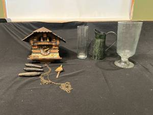 lot 263 image: Vintage Cuckoo Clock with Pendulum, Glassware, and Decorative Metal Pitcher
