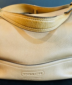 lot 83 image: Coach Tan Leather Purse with Embossed Brand