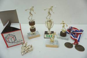 lot 105 image: Assorted sports trophies, softball cube and other