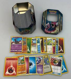 lot 207 image: Misc. Unsorted Pokemon Trading Cards In Misc. Tins