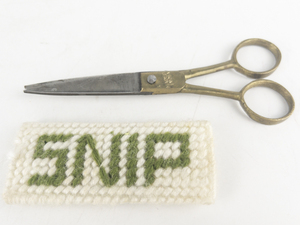 lot 113 image: Vintage Maiden India Gold Tone Scissors with Green & White Yarn SNIP Case