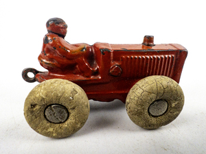 lot 143 image: KILGORE Red Cast Iron Toy Tractor - circa 1930s